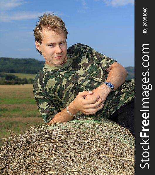 Portrait of a boy on a straw bale. Portrait of a boy on a straw bale
