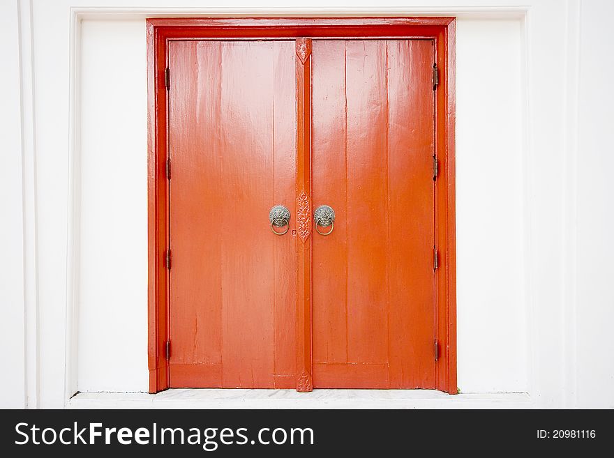 Old thai door with single traditional asian red wooden door closed