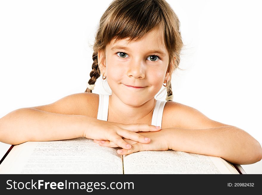 Student girl with a big book isolated on white