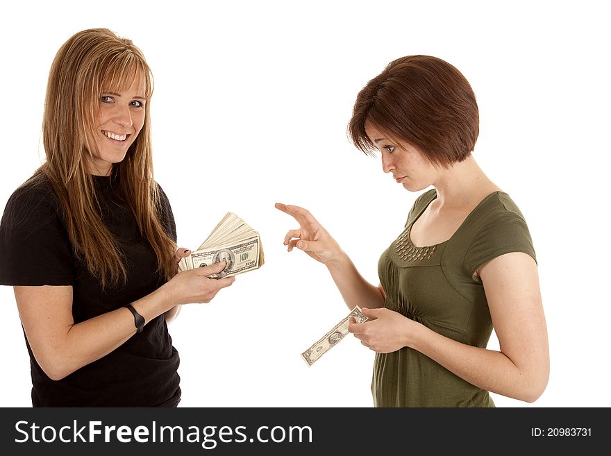 A women wishing she had some money from the other women. A women wishing she had some money from the other women.