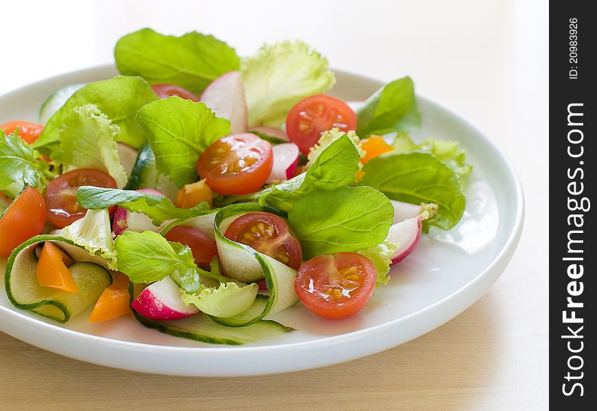 Fresh salad from raw vegetables and lettuce