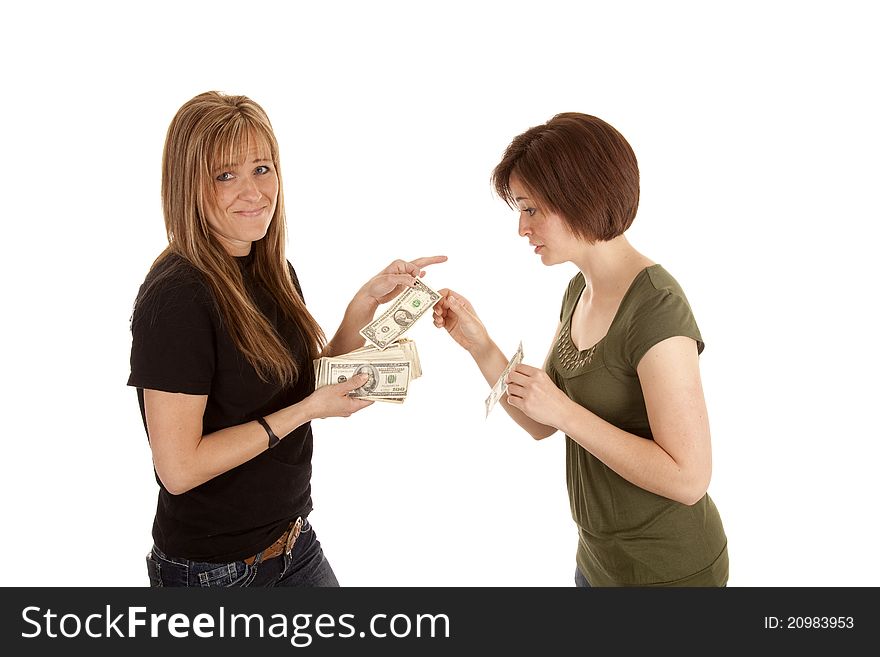 A women giving another women a dollar with a smug look in her face. A women giving another women a dollar with a smug look in her face.