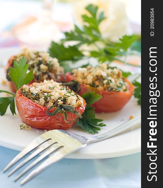Stuffed tomato with crumble. Shallow doff, selective focus. Stuffed tomato with crumble. Shallow doff, selective focus