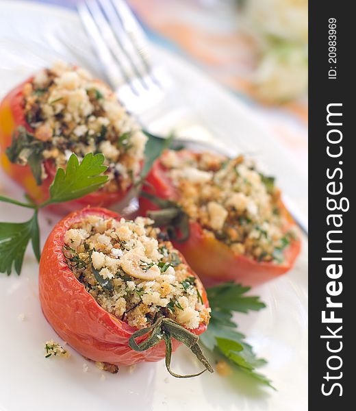 Stuffed tomato with crumble. Shallow doff, selective focus. Stuffed tomato with crumble. Shallow doff, selective focus
