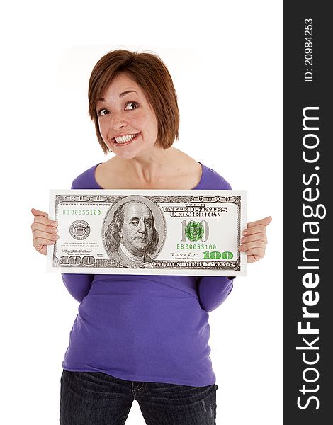 A woman with a happy expression on her face holding a big dollar bill. A woman with a happy expression on her face holding a big dollar bill.