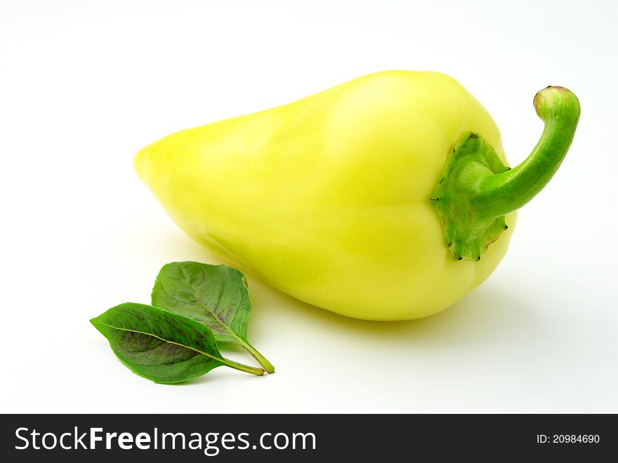 Bulgarian peppers and green basil on a white background. Bulgarian peppers and green basil on a white background