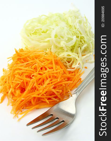 Cabbage and carrots on a white background isolated. Cabbage and carrots on a white background isolated