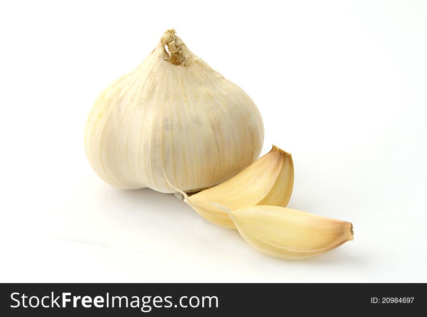 Garlic, pepper and bay leaf on a white background. Garlic, pepper and bay leaf on a white background