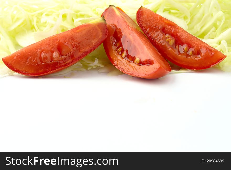 Three pieces of tomato and chopped cabbage. Three pieces of tomato and chopped cabbage