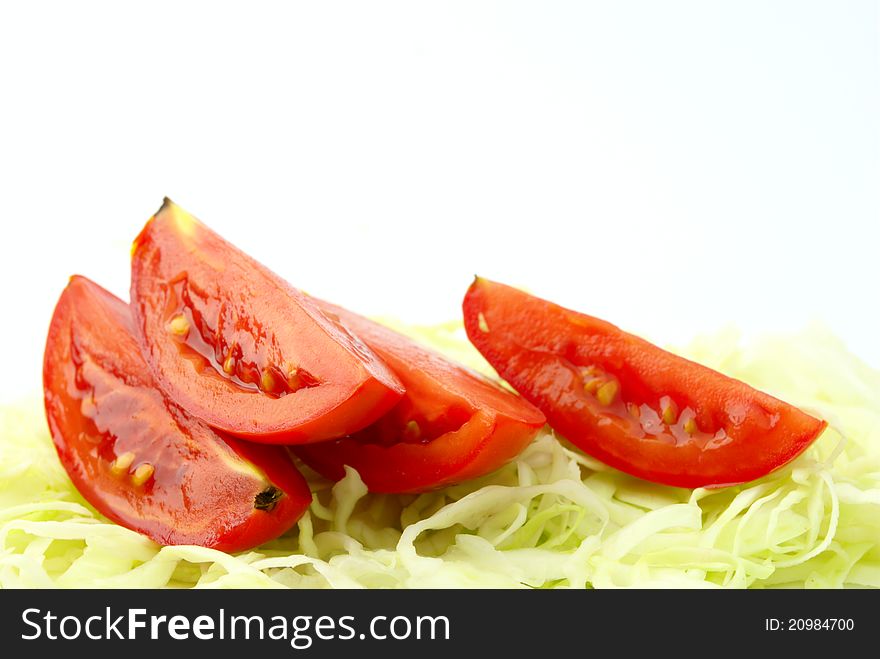 Three pieces of tomato and chopped cabbage. Three pieces of tomato and chopped cabbage