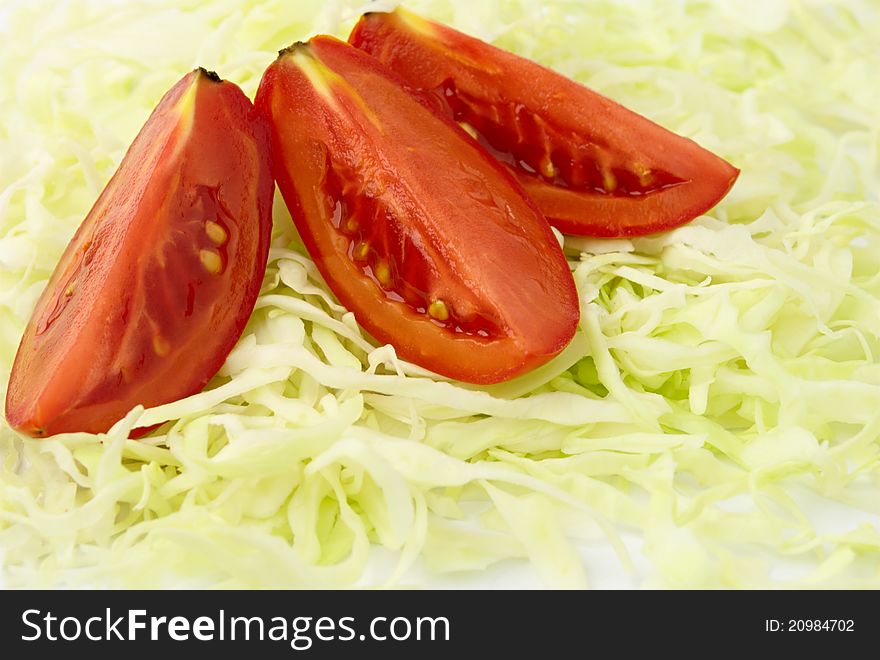 Three pieces of tomato and chopped cabbage. Three pieces of tomato and chopped cabbage