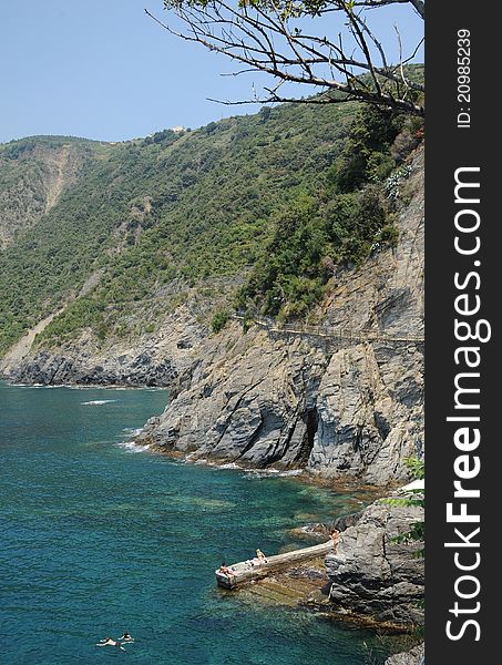 Rocky coastal path between Manorola and Corniglia two of the Italian Cinque Terre villages and a UNESCO world heritage site. Rocky coastal path between Manorola and Corniglia two of the Italian Cinque Terre villages and a UNESCO world heritage site.