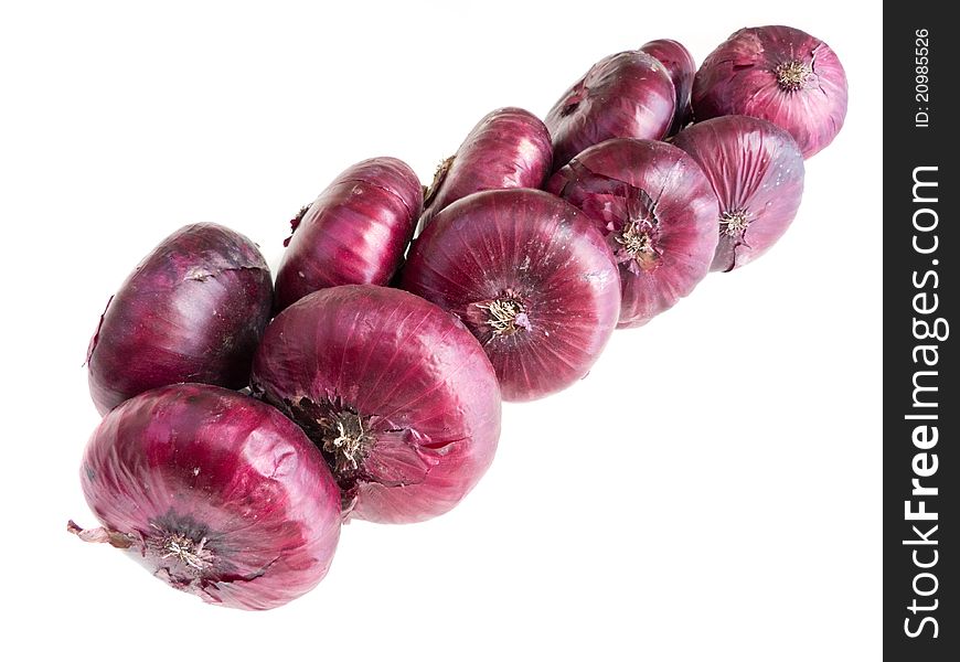Red onions twisted in chain isolated on white. One of different views. Raw format present
