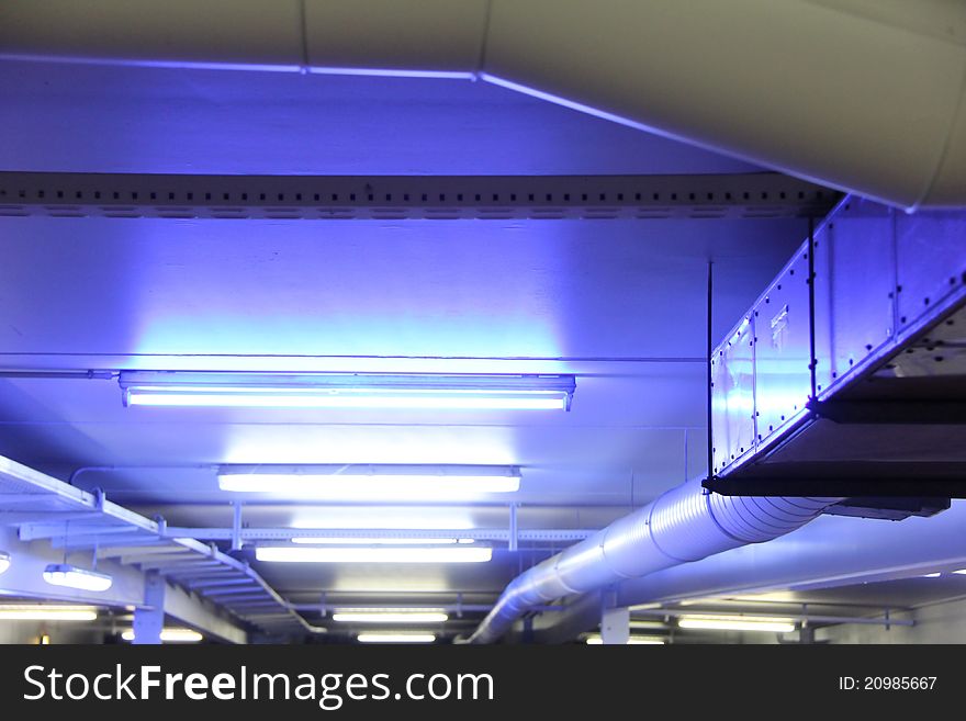 Colorful neon lights on the ceiling of a parking slot