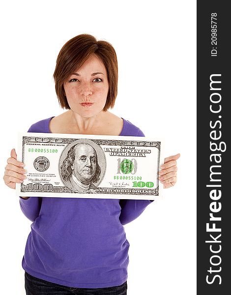 A woman holding a big dollar in her hands with an upset expression on her face. A woman holding a big dollar in her hands with an upset expression on her face.