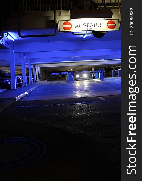 Parking garage with bright neon lights at night