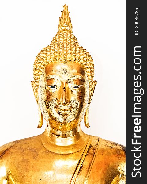 Golden buddha head isolated over a white background. Golden buddha head isolated over a white background.