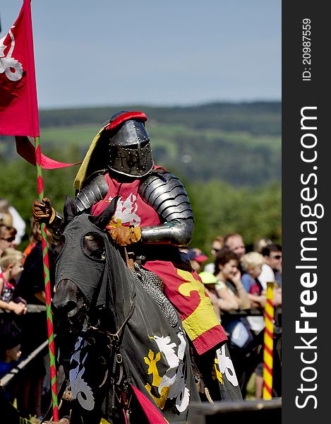 Medieval knight on horseback in a tournamant.