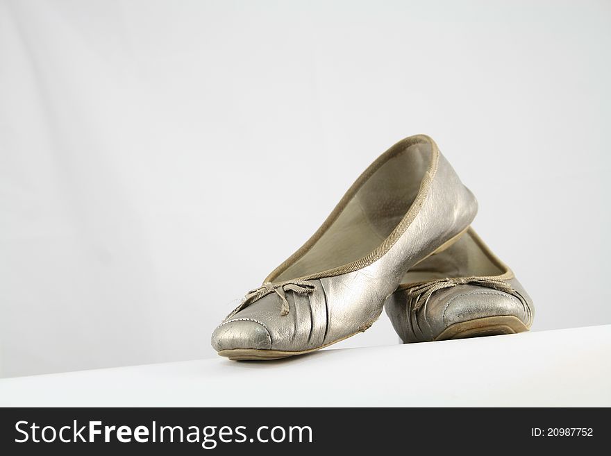 Neutral coloured ballet flats on white background. Neutral coloured ballet flats on white background