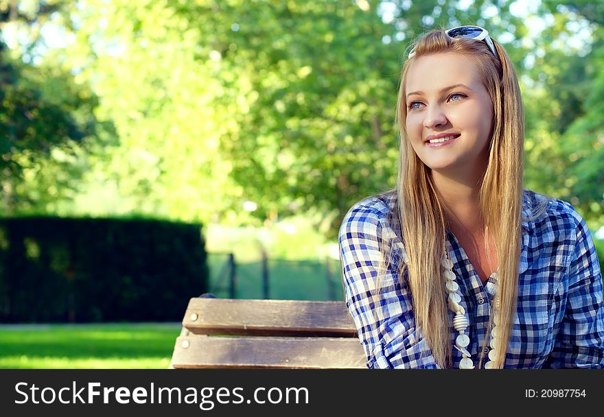 Young happy girl in park
