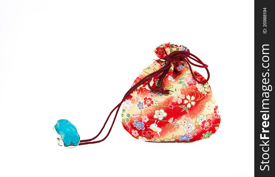 Turquoise  ring and Small red bag