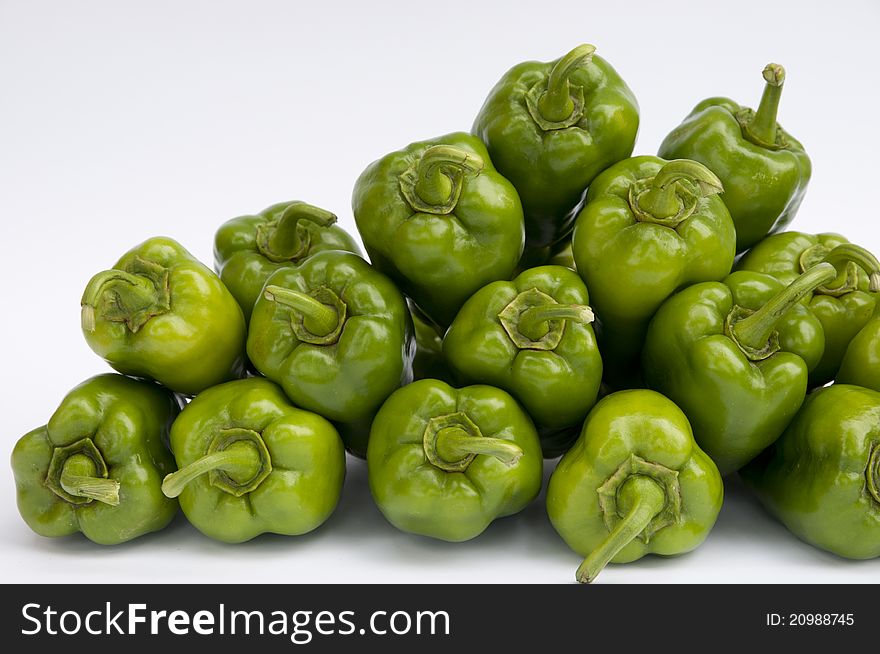 A pile of Peppers on a white background