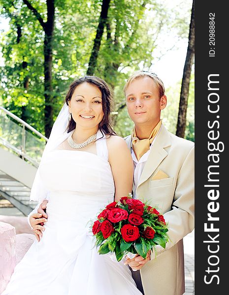 Portrait of bride and groom smiling outdoor