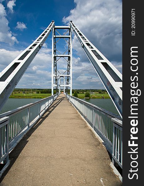 Modern steel bridge over river