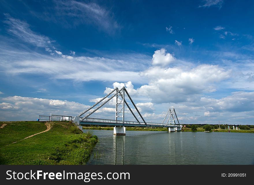 Modern steel bridge over the river