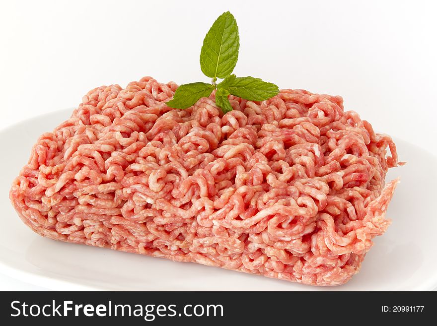 Minced pork and beef for burgers on the grill. Minced pork and beef for burgers on the grill