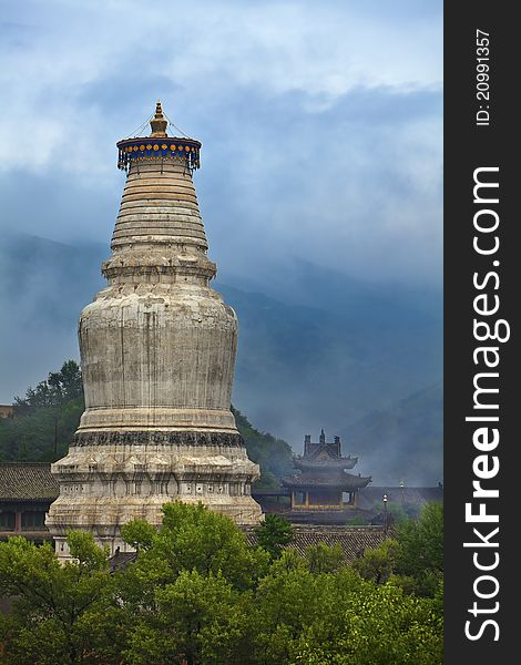 The chinese tower in front of a temple, this tower has already had a history of a thousand years.