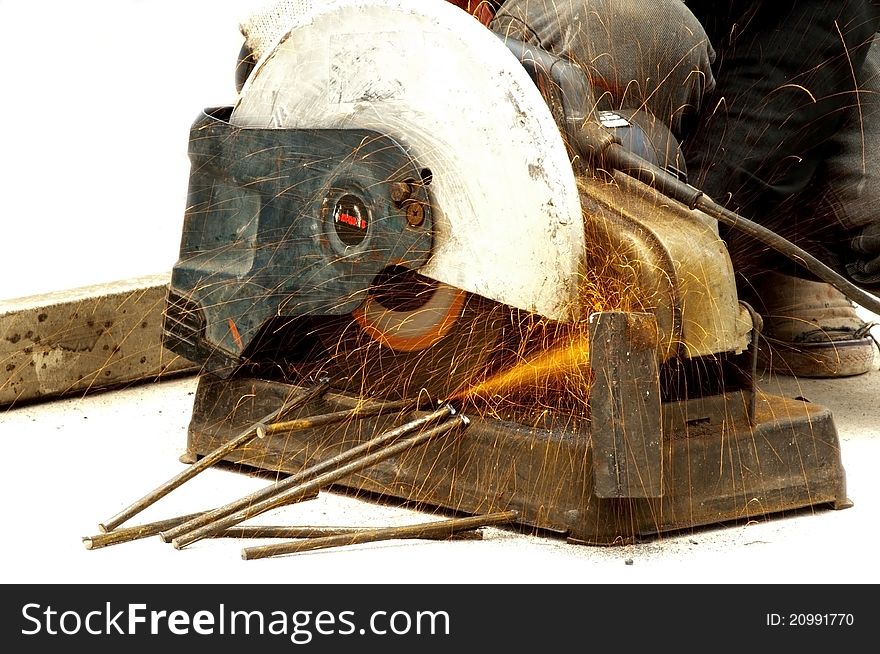 Worker cutting steel with high speed wheel