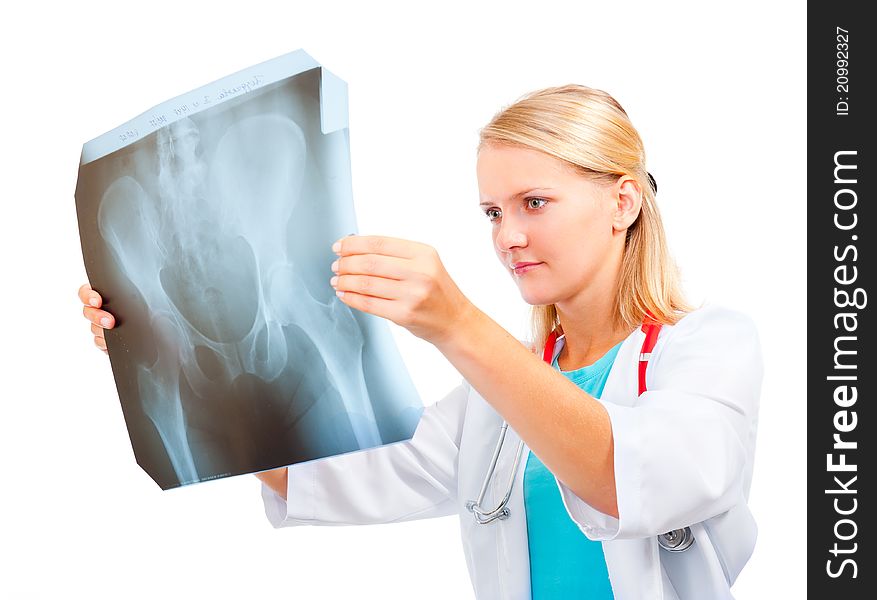 Young doctor examining an x-ray image of the pelvis