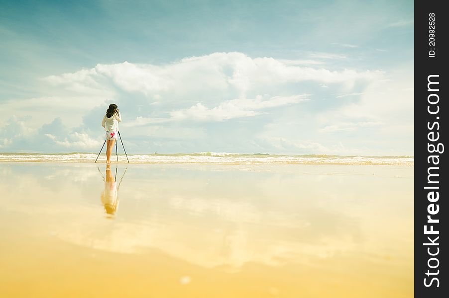 Female photographer in Heaven, where the sky meets the land, blue sky, great landscape,. Female photographer in Heaven, where the sky meets the land, blue sky, great landscape,