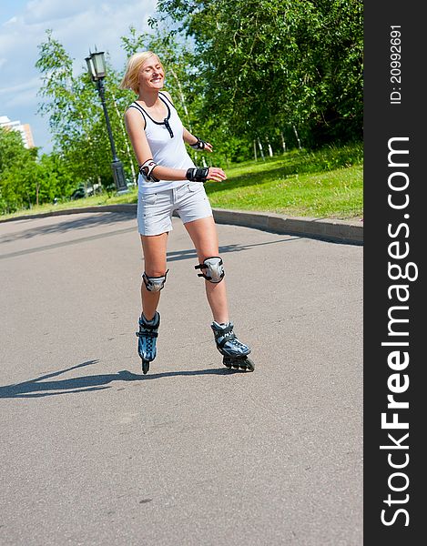 Girl roller-skating in the park