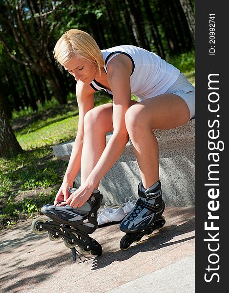 Girl roller-skating in the park