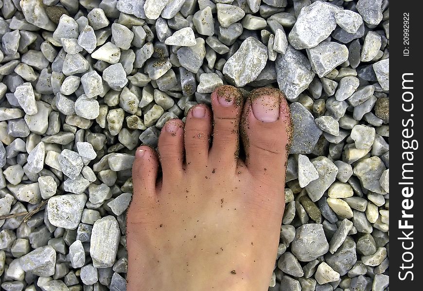 Foot With Sand And Stone