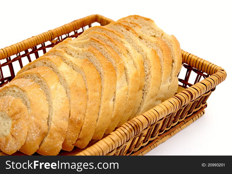 Sliced ??bread in a basket on a white background. Sliced ??bread in a basket on a white background