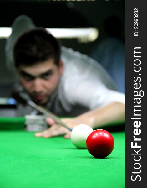 Snooker Player Face Blurred While Playing Shot. Snooker Player Face Blurred While Playing Shot.