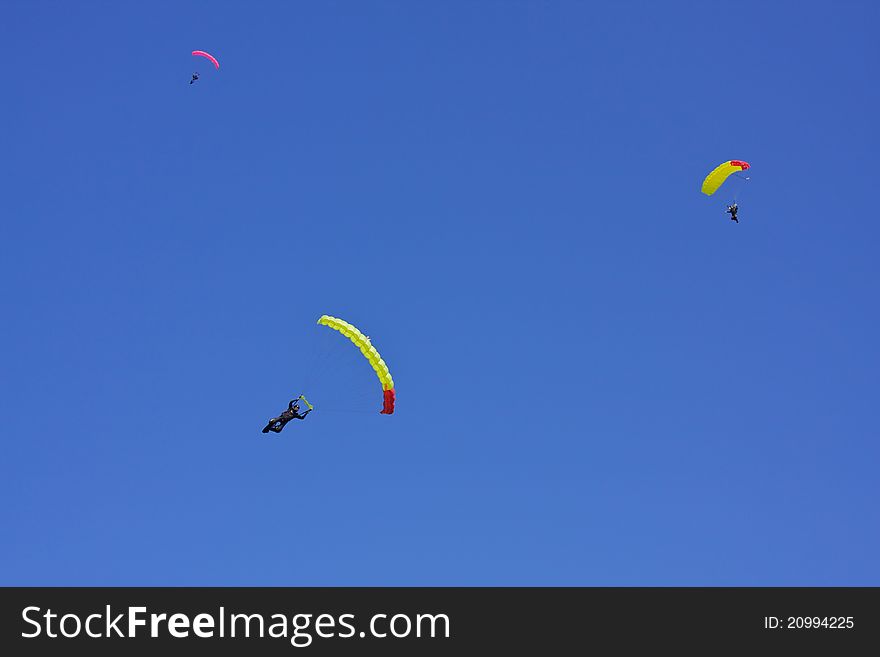 Three jumper against the blue sky formed a distinct geometric shape. Three jumper against the blue sky formed a distinct geometric shape