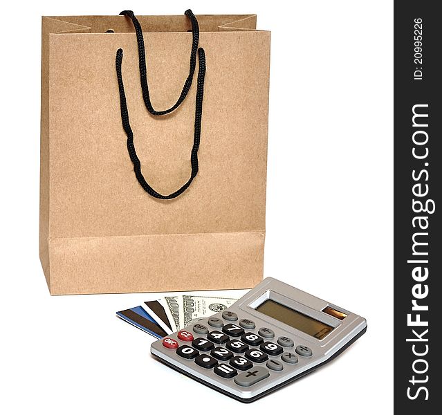 Shopping bag, plastic card, calculator and cash - shopping concept