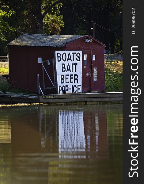 Red boathouse and dock on the lake