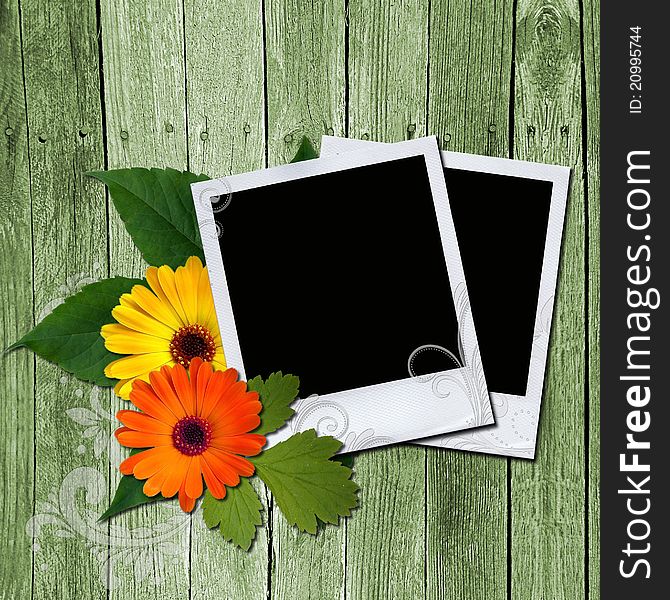 Two photo frames and flowers on wooden texture. Two photo frames and flowers on wooden texture