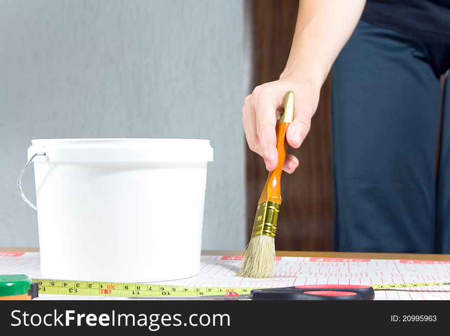 Young woman prepare wallpaper for wall. Young woman prepare wallpaper for wall