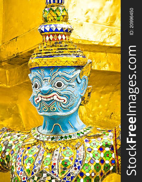 Face to giant thai on gold background