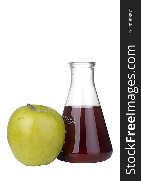 Green apple and an erlenmeyer flask with red liquid on a white background. Green apple and an erlenmeyer flask with red liquid on a white background.