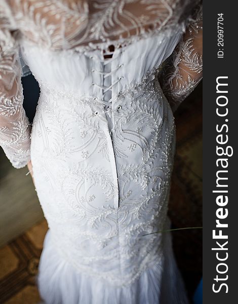 Image of back of bride in wedding dress