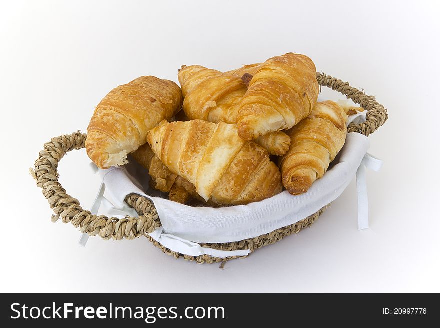 Wicker basket with croissants varied. Wicker basket with croissants varied