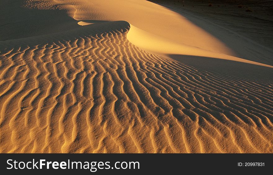 Desert, waves, golden sand and sky.white sand. Desert, waves, golden sand and sky.white sand.