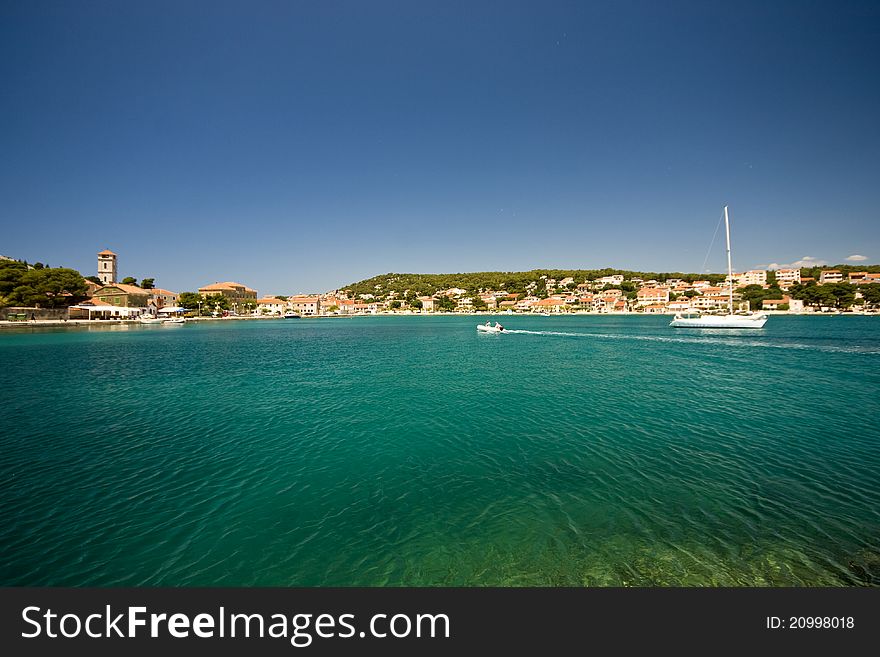 Emerald sea water and the lovely houses in Tisno. Emerald sea water and the lovely houses in Tisno